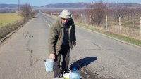 81 year old man on a mission to fill potholes on the road between two villages