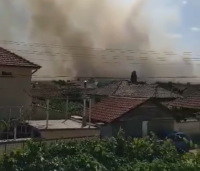 Helicopter battles large wildfire raging near the village of Starosel